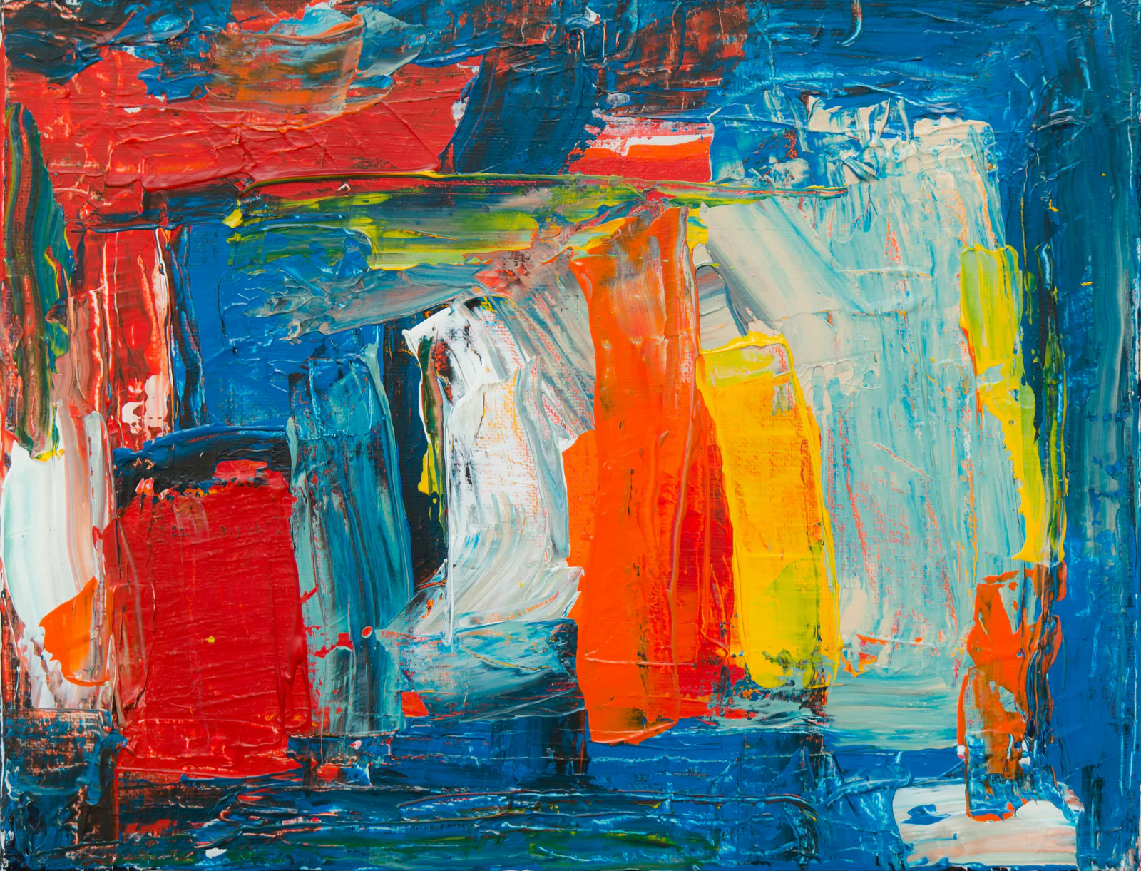Layered blue, orange, and red paint texture for art installation